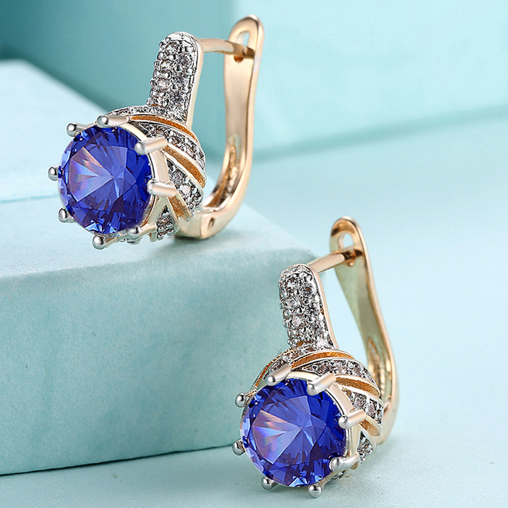 Elegant Vienna 1.00 Ct Sapphire Round Cut Huggie Earring in 18K Gold Plated, showcasing a brilliant sapphire set in a gold-plated huggie design.